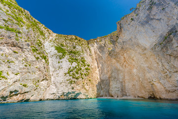 Fototapeta na wymiar Greece island white cliffs and blue sea.