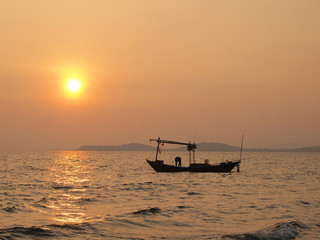 Beautiful sunset over the sea and Fishing boat