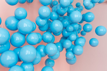 blue balloons, blue bubbles on pink background. Modern punchy pastel colors. Dream fantasy concept