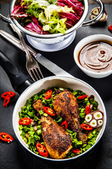 Grilled chicken drumsticks and vegetables