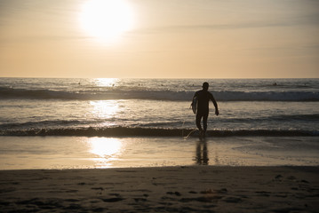 Fototapeta na wymiar Out for sunset surf