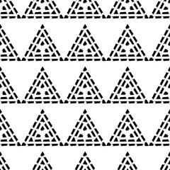Seamless geometric pattern. Black and white texture. Drawn triangles. Drops texture. Brushwork. Scribble texture. Textile rapport.