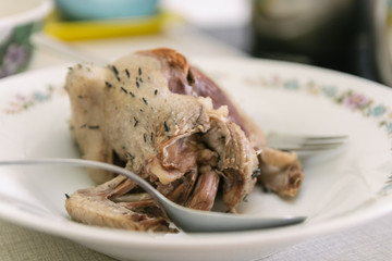 Roast pigeon on a plate ready for dinning
