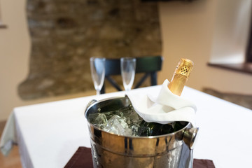 Champagne bottle in a bucket with ice