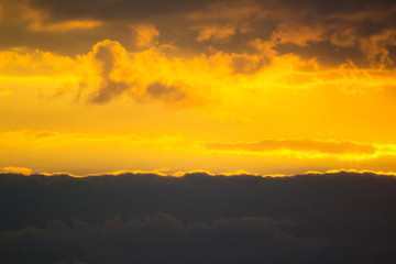 bright orange sky behind the clouds