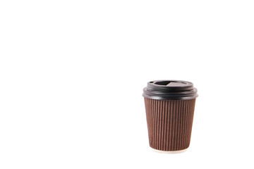 Brown carton disposable safe heat resistant double walled paper take out coffee cup to go. Colorful eco-friendly cardboard mug for hot beverages, black cap. Isolated background, close up, copy space.