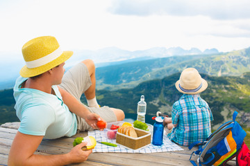 Family on a picnic in the mountains