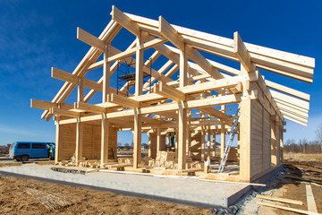 Construction of a house made of laminated veneer lumber. The frame of the house. Cottage made of...