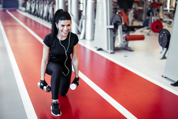 dumbbell lunge woman workout exercise at gym, one leg split squats