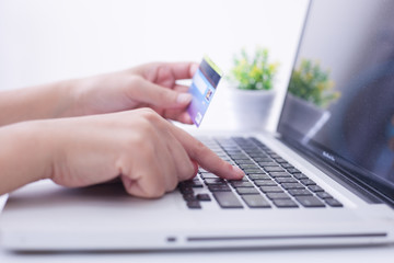 Women hands making online payment with laptop for shoping