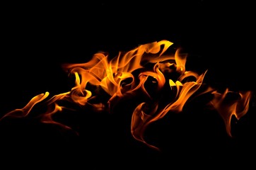 Fire flames on black background. Fire is the oxidation of the material rapidly in the exothermic...