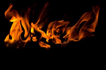 Fire flames on black background. Fire is the oxidation of the material rapidly in the exothermic...