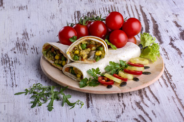Tortilla, sauce, salad and tomato. Delicious and healthy meal. Mexican specialty. Mexican very popular specialty.