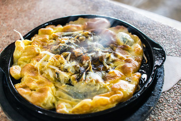 Oyster omelette in Hot pan.