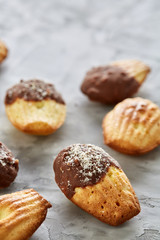 Tasty almond cookies arranged on white background, close-up, selective focus