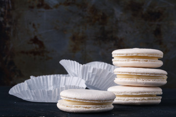 White macaroons on rustic table