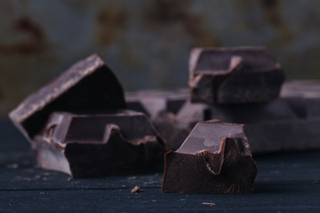 Crunch dark chocolat on rustic table