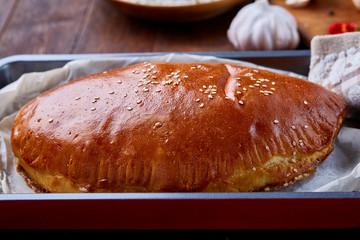 Country side still life with homemade pastries, coffee cup, herbs, vegetables over a vintage background, selective focus