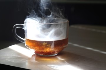 mug with smoke on a table