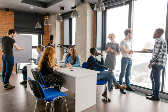busy students resting before the conference in office - Powered by Adobe