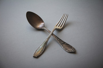  Crossed vintage forks and spoons