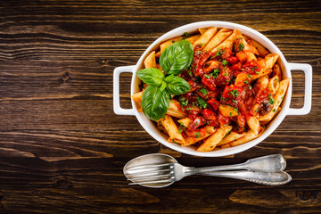 Penne with meat, tomato sauce and vegetables