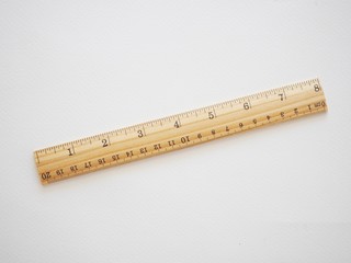 Ruler made of wood on drawing paper