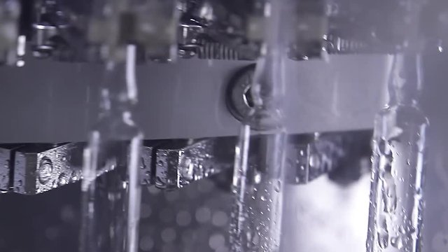 The work of the conveyor to fill the vaccine vials. Modern pharmaceutical plant.