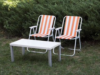 Fototapeta premium Two garden chairs and a table