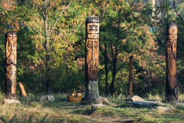 Wooden sculptures of pagan gods on island Khortitsa in city Zaporozhye, Ukraine - obrazy, fototapety, plakaty