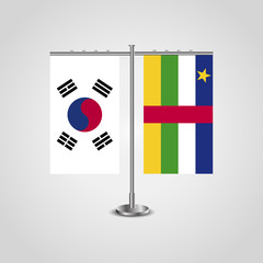 Table stand with flags of South Korea and Central African Republic.Two flag. Flag pole. Symbolizing the cooperation between the two countries. Table flags