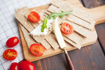 Diet food ingredients on dark wooden background