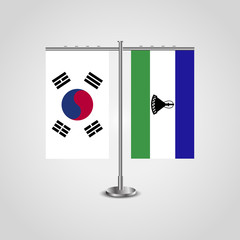 Table stand with flags of South Korea and Lesotho.Two flag. Flag pole. Symbolizing the cooperation between the two countries. Table flags
