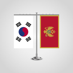 Table stand with flags of South Korea and Montenegro.Two flag. Flag pole. Symbolizing the cooperation between the two countries. Table flags