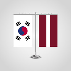 Table stand with flags of South Korea and Latvia.Two flag. Flag pole. Symbolizing the cooperation between the two countries. Table flags