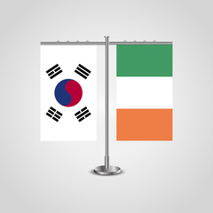 Table stand with flags of South Korea and Ireland.Two flag. Flag pole. Symbolizing the cooperation between the two countries. Table flags