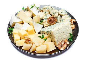 various types of cheese in dark plate
