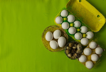 White chicken Chicken and quail eggs in colored paper eco-friendly packaging with  sisal Close-up photo Easter background 