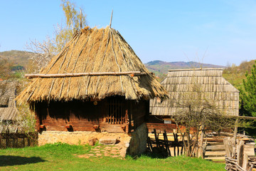 Fototapeta na wymiar Traditional old wooden house with straw roof