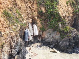California Coastal Cliffs with Boats Hanging from the Rocks