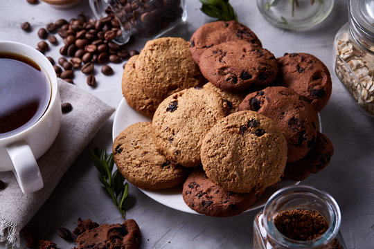 Breakfast background with mug of fresh coffee, homemade oatmeal cookies, grind coffee - Powered by Adobe