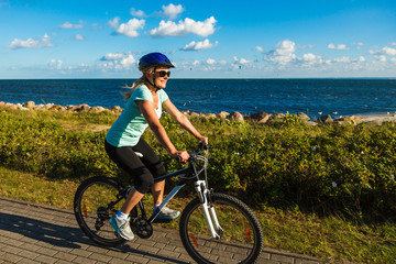 Healthy lifestyle - middle-aged woman riding bicycles