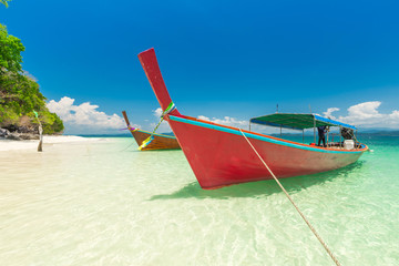 White sand beach and Long-tail boat at Khang Khao Island (Bat island), The beautiful sea Ranong Province, Thailand.