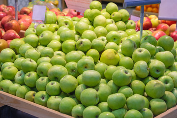 Pile of apples on the stall in the supermarket