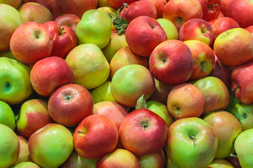 A pile of red-green apples as background, texture