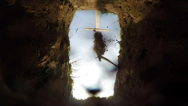 VIew from a grave, the grave is being closed, and the camera lens eventually gets totally covered.