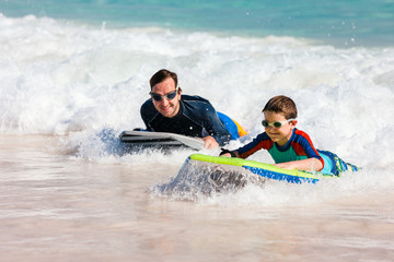 Father and son boogie boarding
