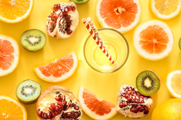 various fruits and a glass with a straw
