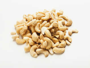 Heap of cashew nuts isolated on white