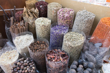 Different spices and nuts in bags on the market.